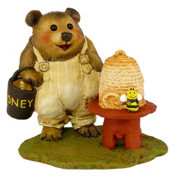 Bear bee keeper with hive