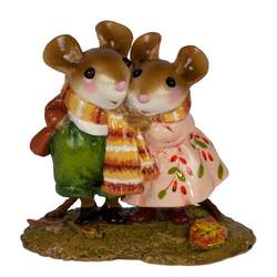 Two mice in love, wrapped together in a long scarf.