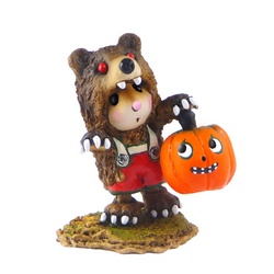 Mouse in bear costume with pumpkin