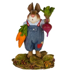 Mr. Harvest Bunny hold up his prize carrots and beets