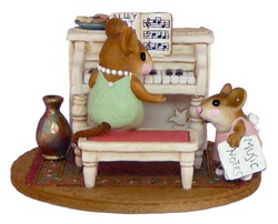 Young girl mouse coming up for her piano lesson