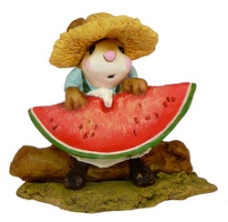 Boy with straw hat eating large slice of water mellon