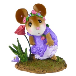Girl mouse holds her dress down while looking a flower