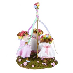 Three girl mice dance around a May Pole