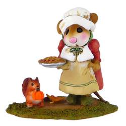 Female pioneer mouse hold a pumpkin pie with squirrel at her feet