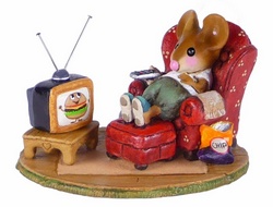 Father mouse lying back in his armchair with his feet up watching TV