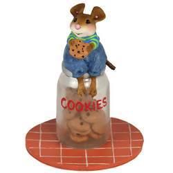 Boy mouse sits on top of class jar filled with cookies