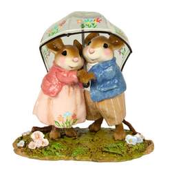 Young mouse couple sharing a decorated, transparent rain umbellar.