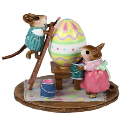 Two mice, making with the painting of a giant mouse-sized Easter egg!