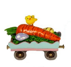 A tiny little chick is sitting on a carrot that can be pulled by the Easter train! 