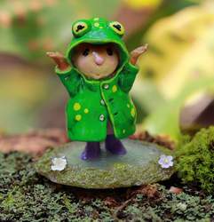 There's no better place to be than standing in a puddle with rain boots embracing the warm summer rain! This limited edition mouse is wearing a carefully painted frog raincoat