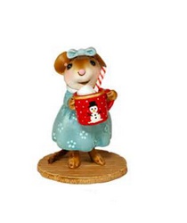 Hot chocolate is enveloping this little one as she prepares for her first sip of a holidays