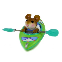 Mouse, holding his paddles out of the water, in a canoe