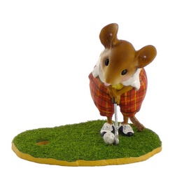 Male golfer mouse putting, dressed in tweed pants